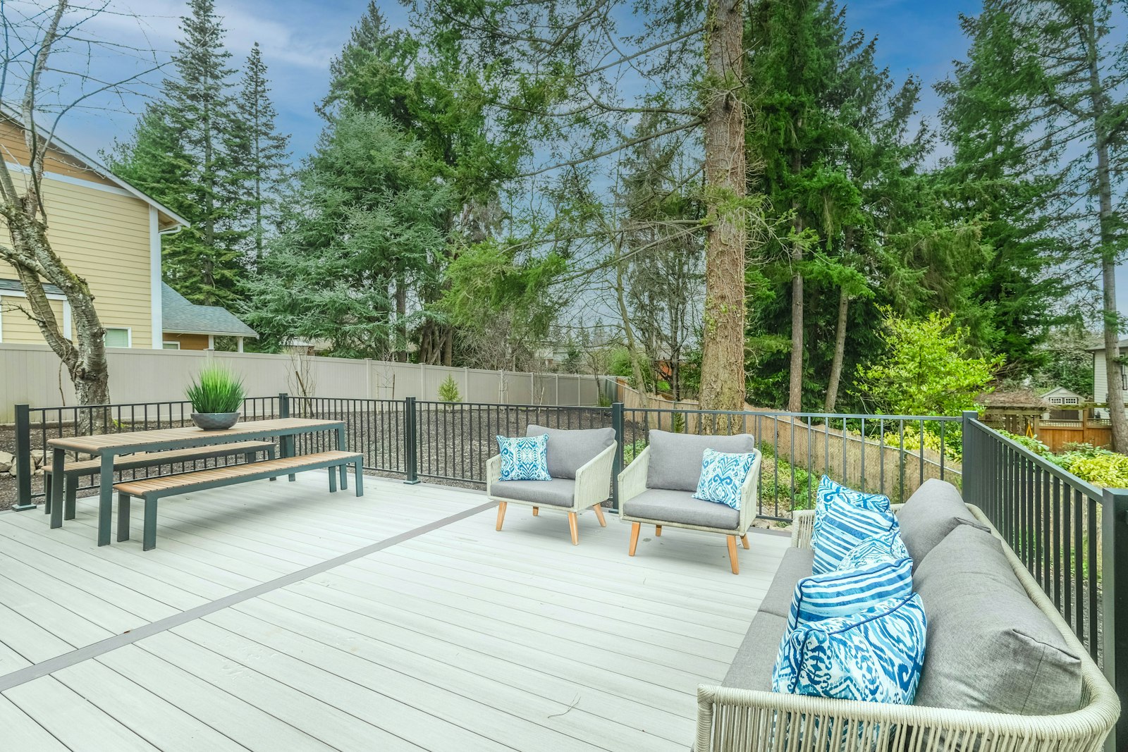 Spacious composite deck with outdoor furniture looking bright and new