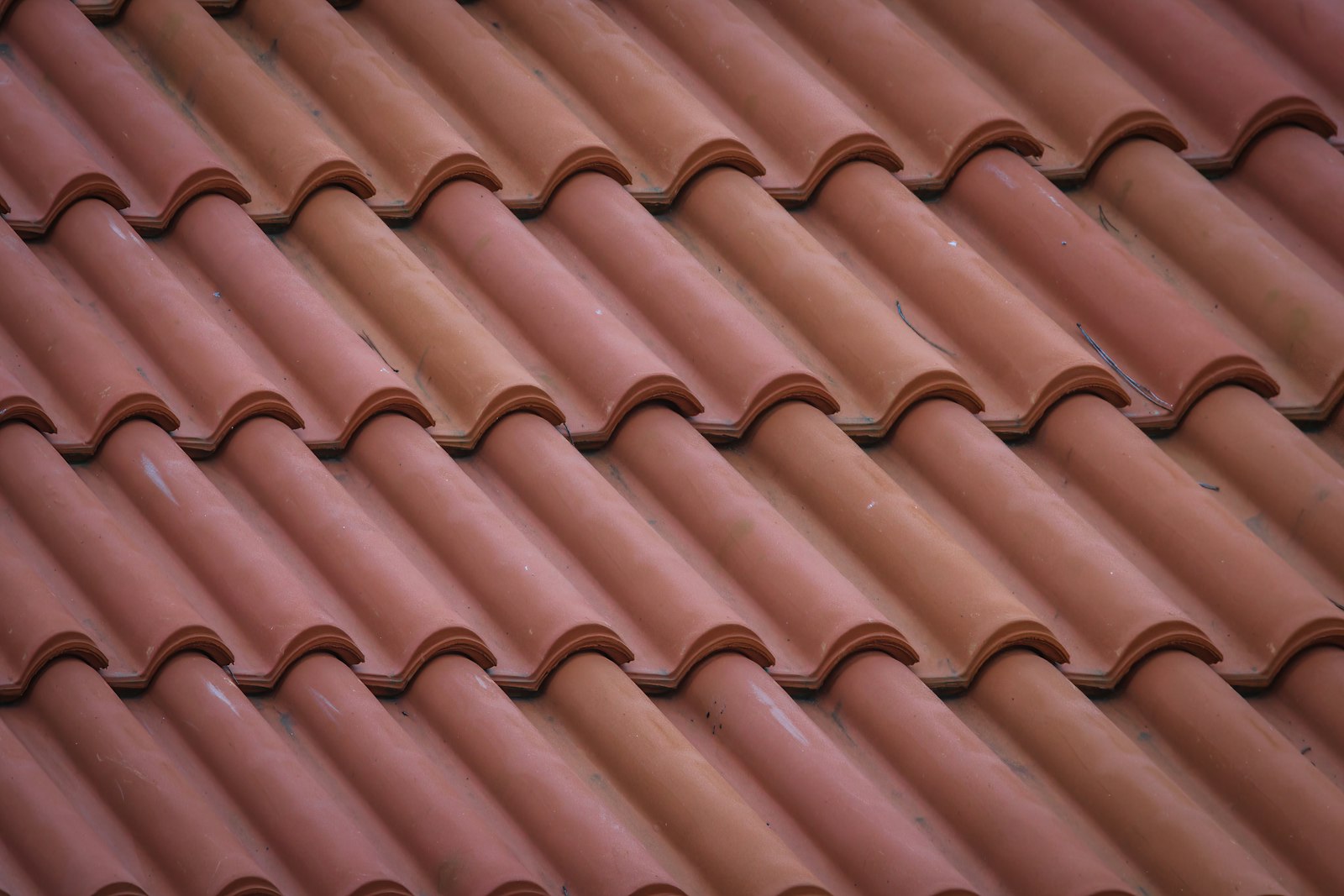 Clay tile roof restored to an even terracotta color after a soft wash